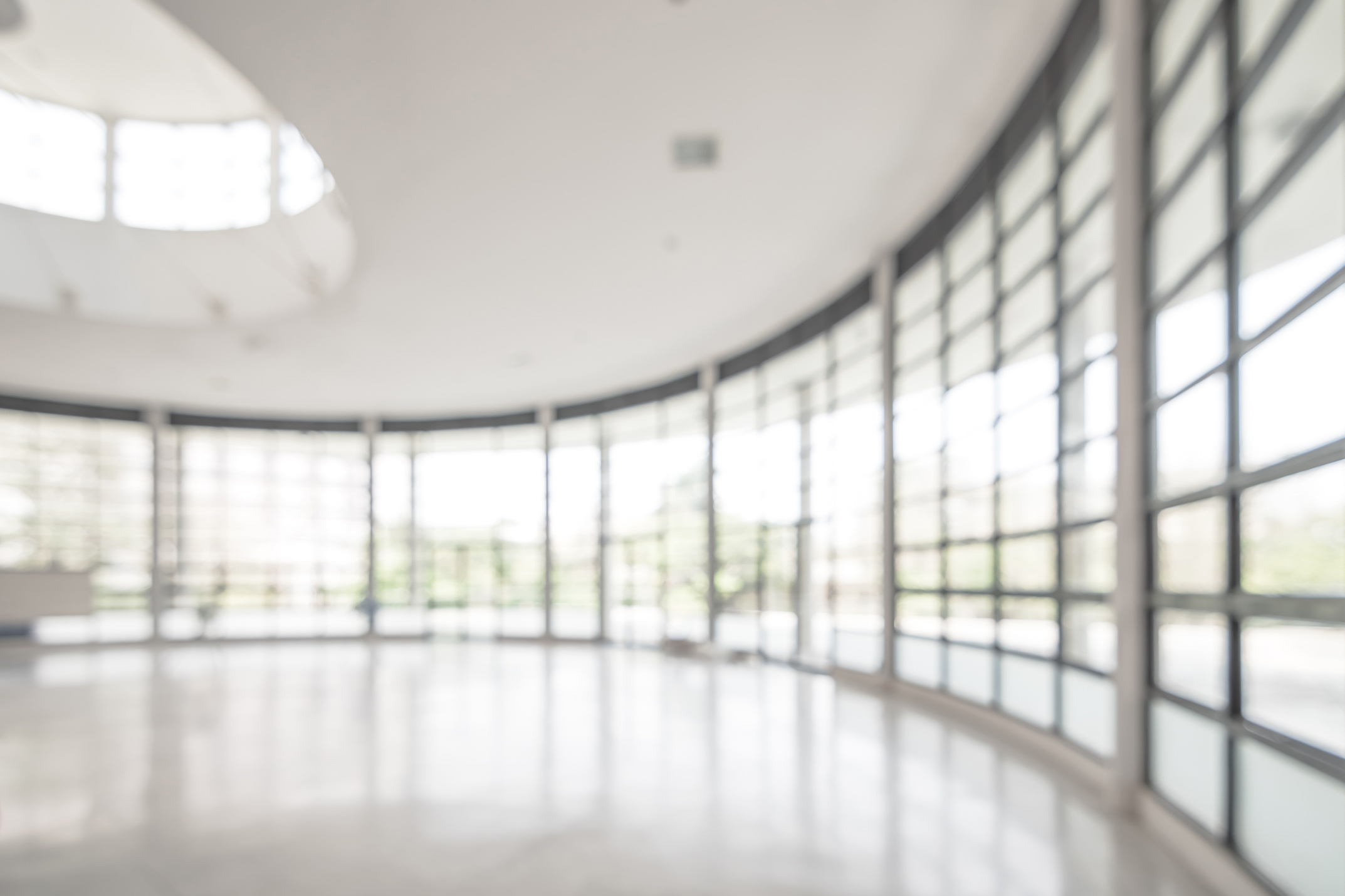Office building business lobby blur background with blurry glass window transparent wall interior view inside empty entrance hall